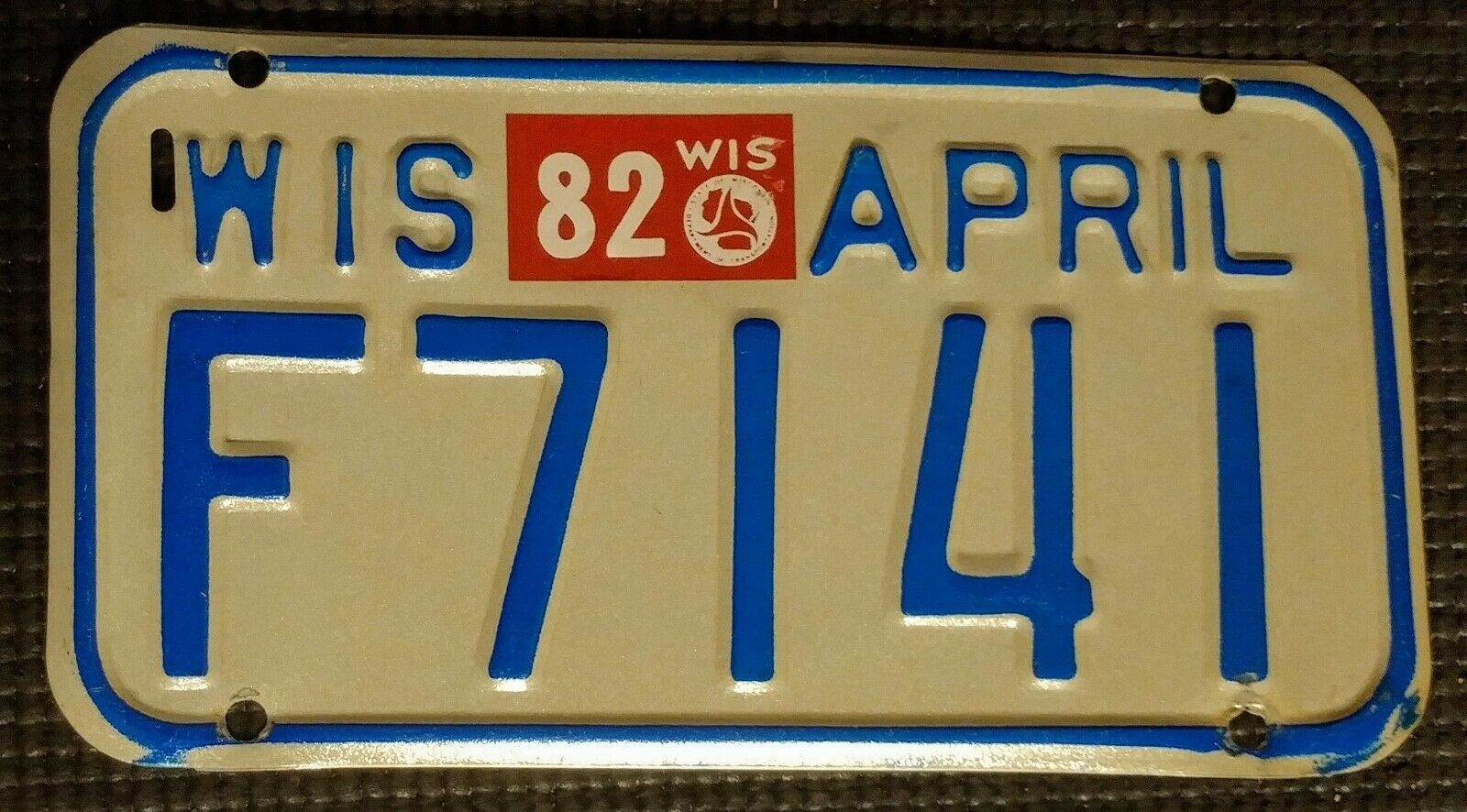 1981 Vintage Wisconsin Motorcycle License Plate F7141 Blue / White - 82 Sticker